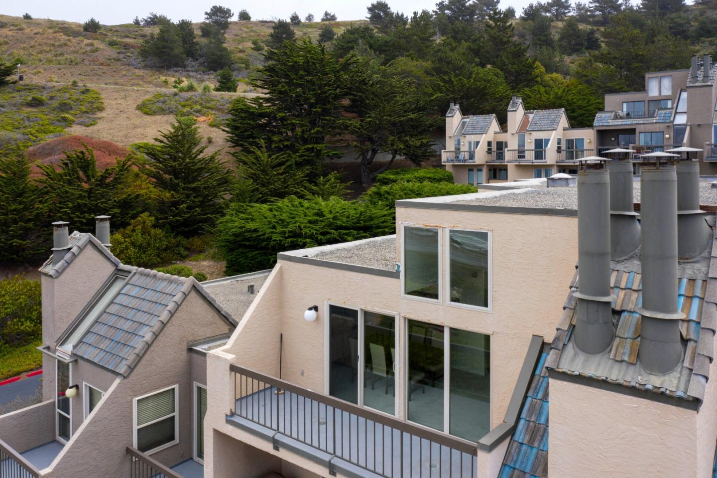 457 Roberts Road Pacifica, CA 94044 - Photo 24 of 29 a view of a patio with a table and chairs