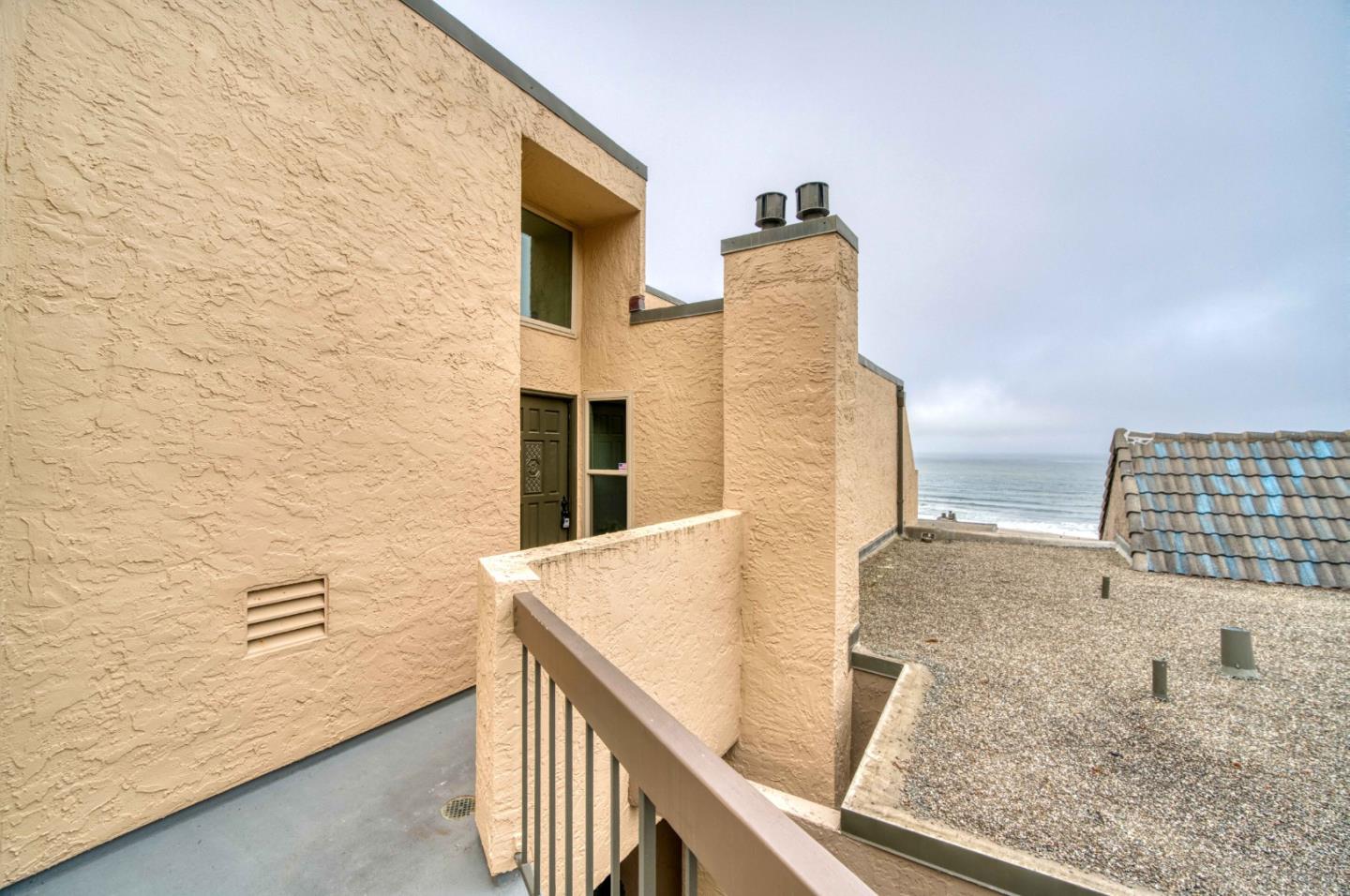 457 Roberts Road Pacifica, CA 94044 - Photo 26 of 29 a view of staircase with wooden floor and white walls