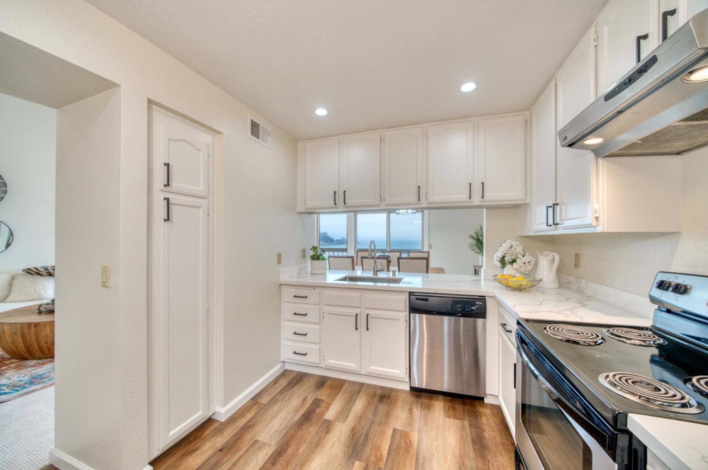 457 Roberts Road Pacifica, CA 94044 - Photo 6 of 29 a kitchen with stainless steel appliances granite countertop a stove and a refrigerator