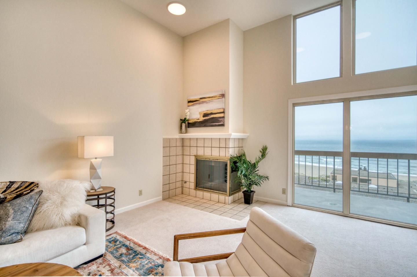 457 Roberts Road Pacifica, CA 94044 - Photo 7 of 29 a spacious bedroom with a bed and a lamp