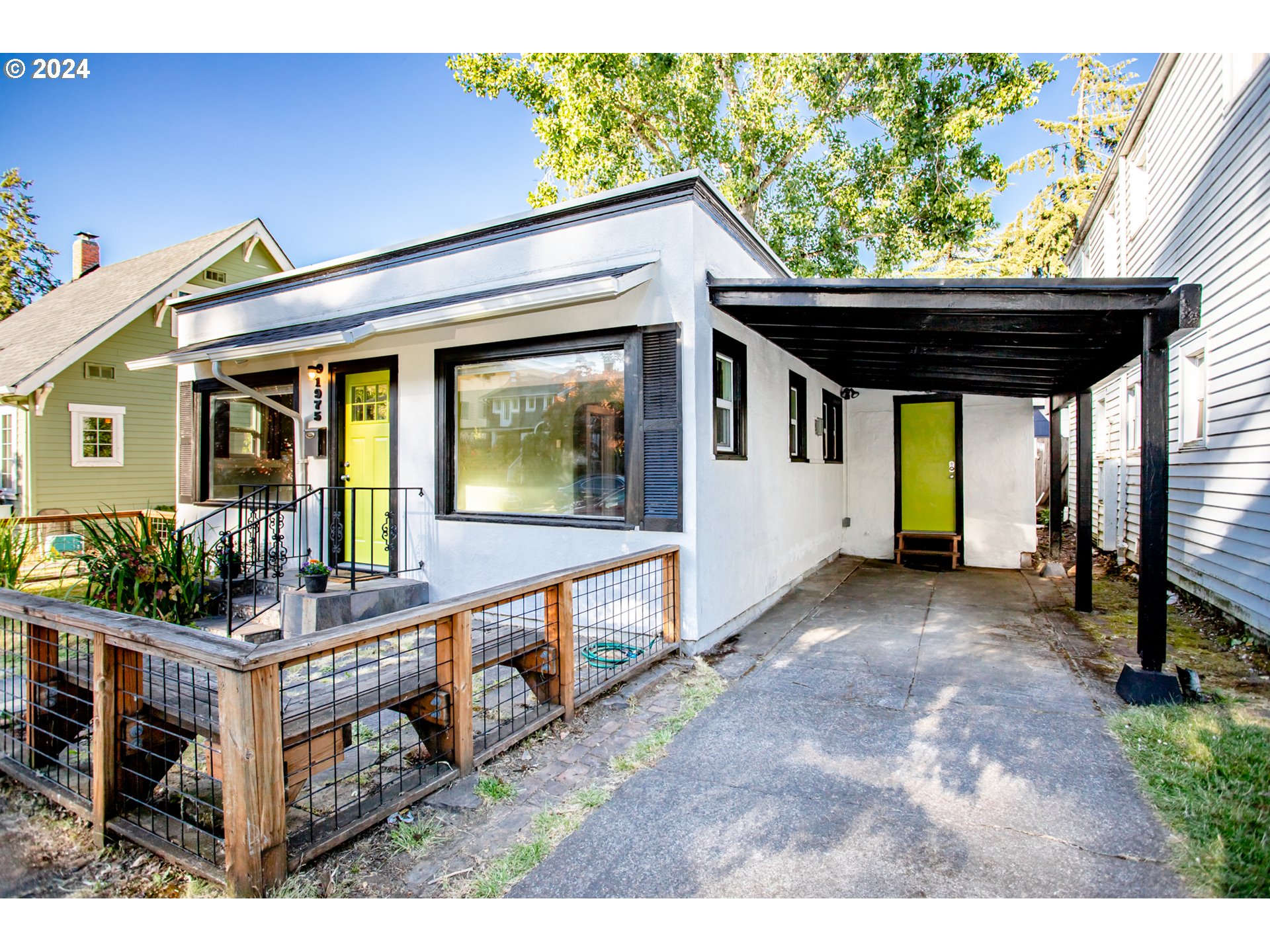 1975 Emerald Street Eugene, OR 97403 - Photo 1 of 19 a view of house with outdoor seating and trees in the background