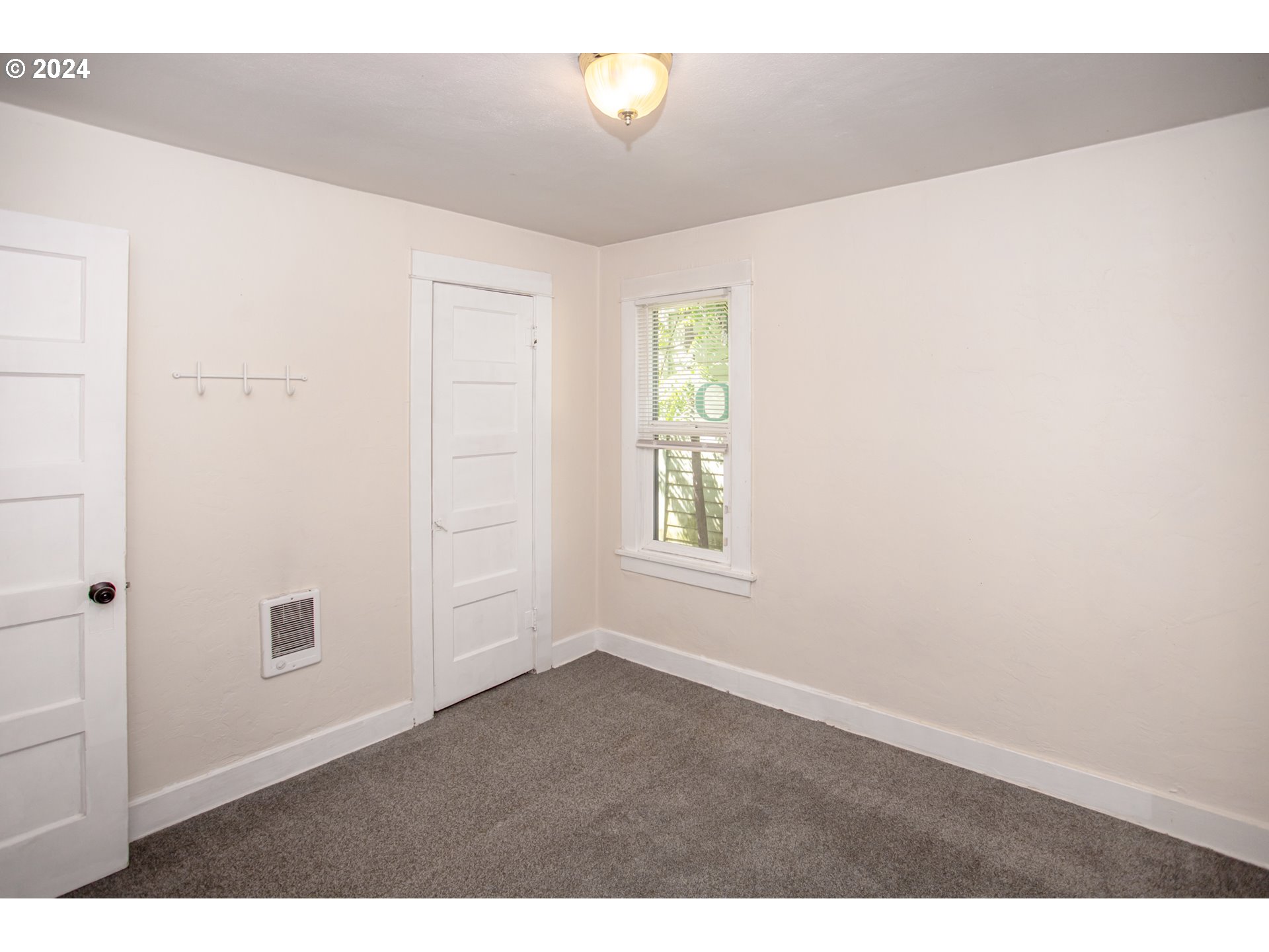 1975 Emerald Street Eugene, OR 97403 - Photo 12 of 19 a view of an empty room with a window