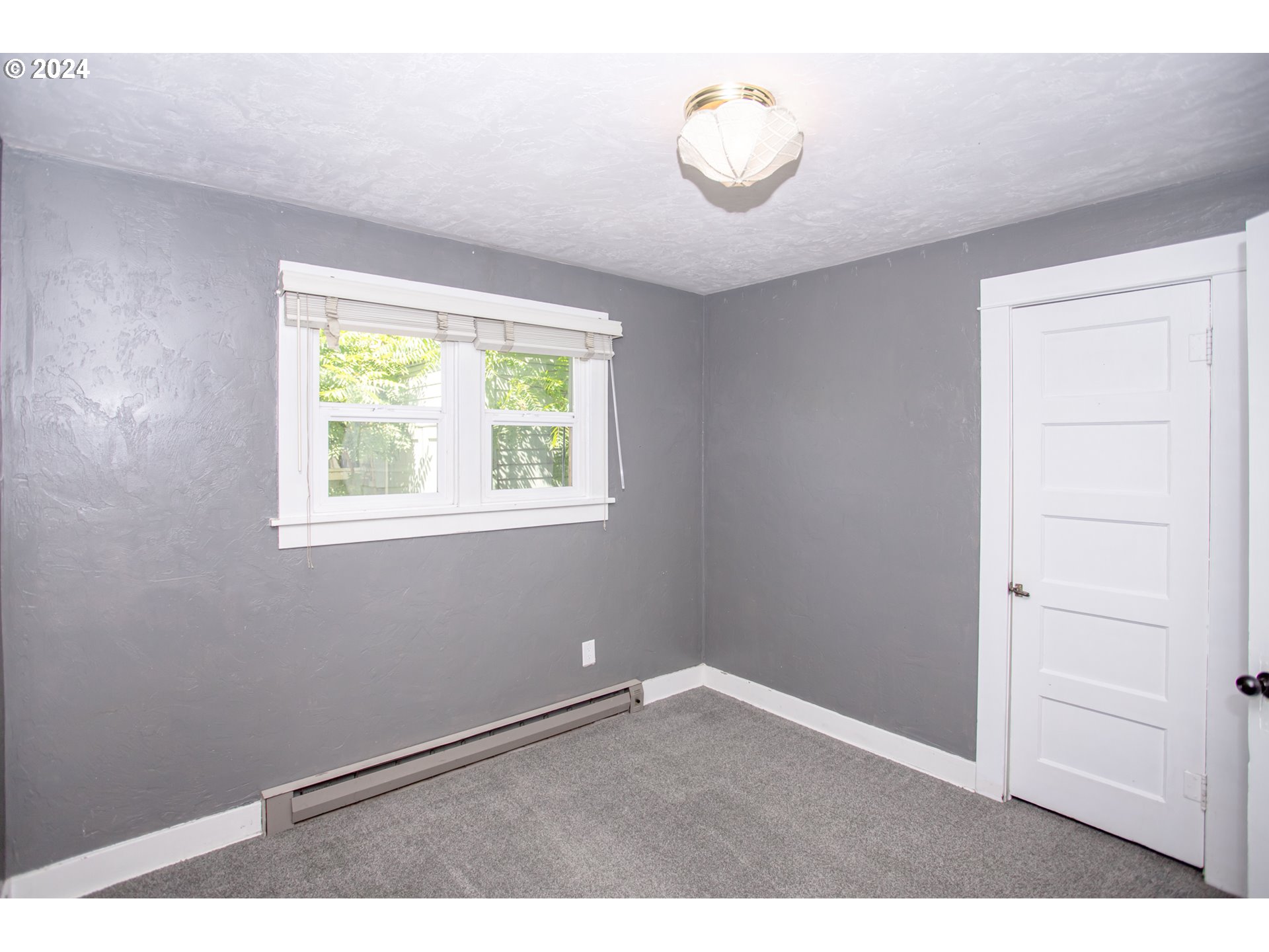 1975 Emerald Street Eugene, OR 97403 - Photo 13 of 19 an empty room with windows