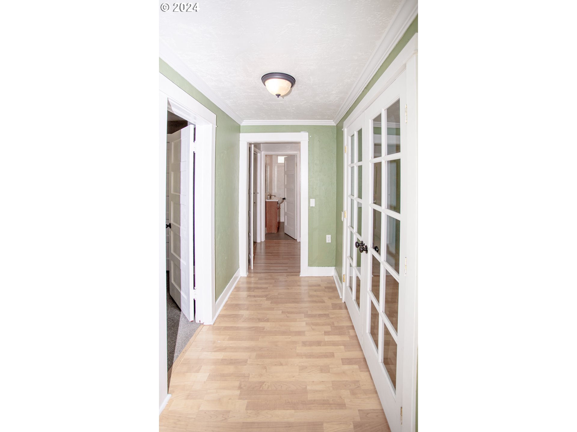 1975 Emerald Street Eugene, OR 97403 - Photo 17 of 19 a view of a hallway with wooden floor