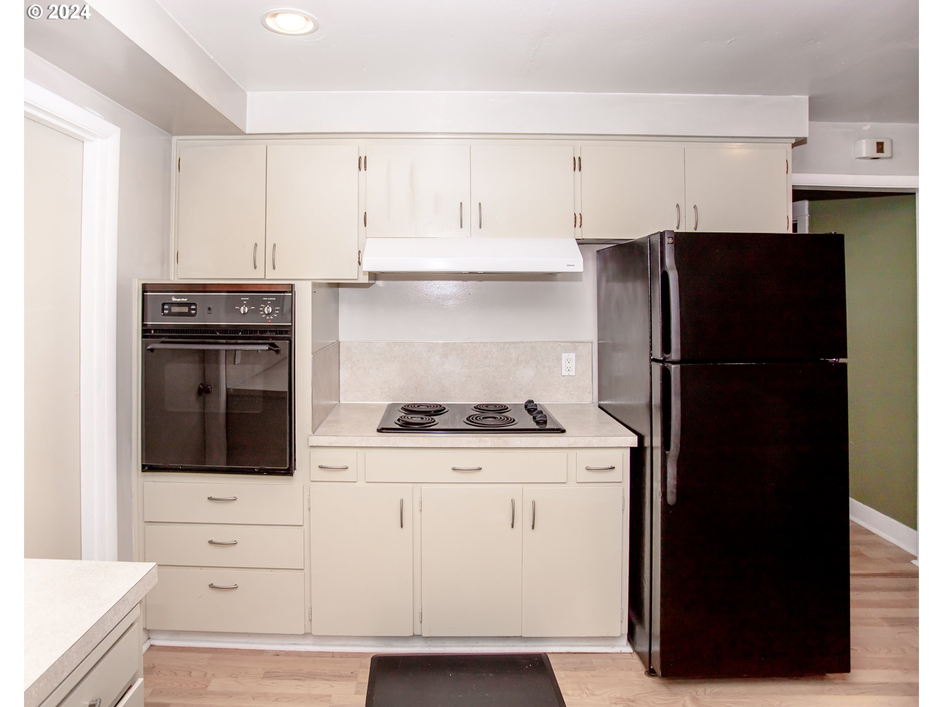1975 Emerald Street Eugene, OR 97403 - Photo 5 of 19 a kitchen with stainless steel appliances a stove refrigerator and cabinets