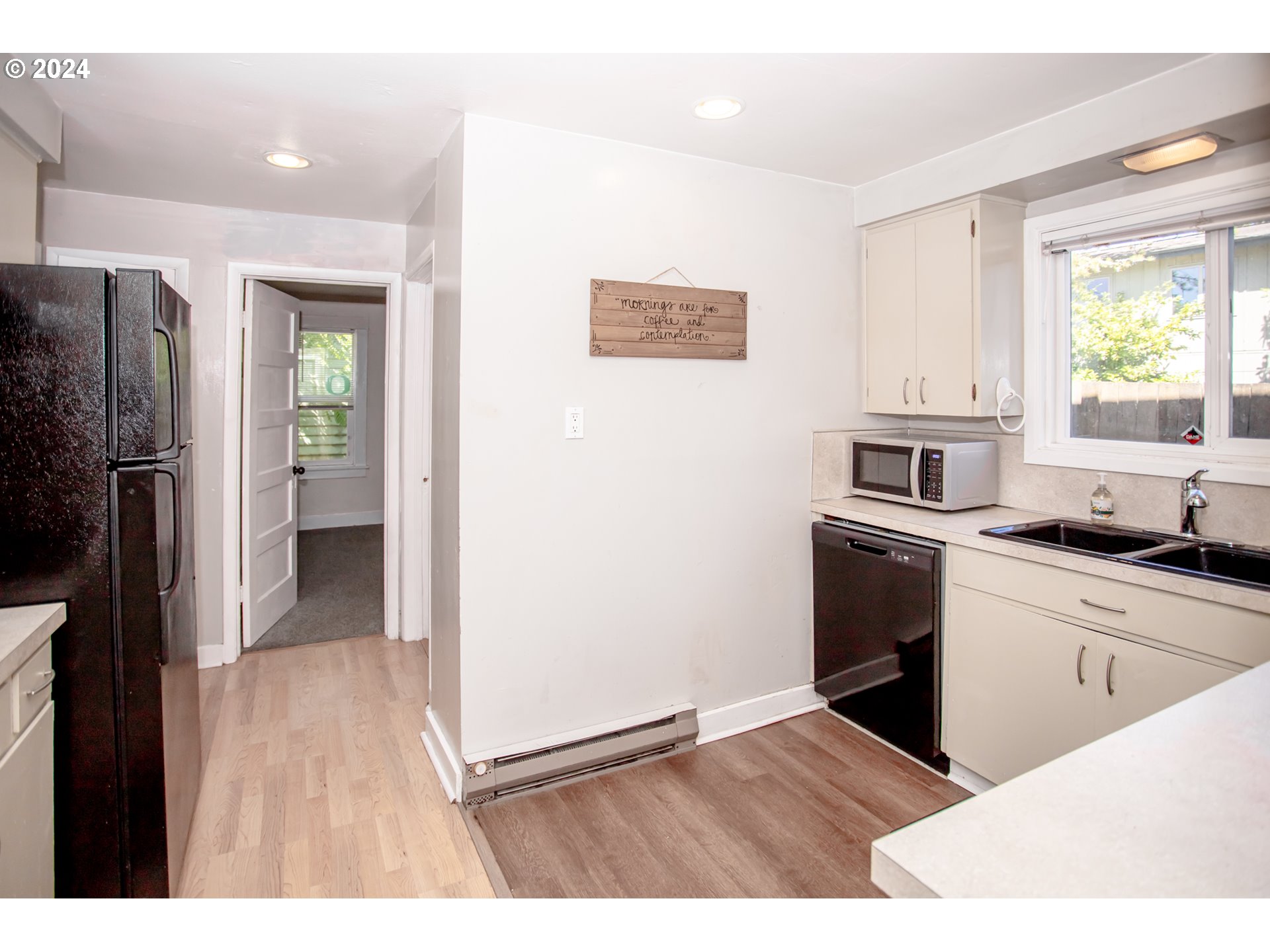 1975 Emerald Street Eugene, OR 97403 - Photo 6 of 19 a kitchen with granite countertop a refrigerator and a sink