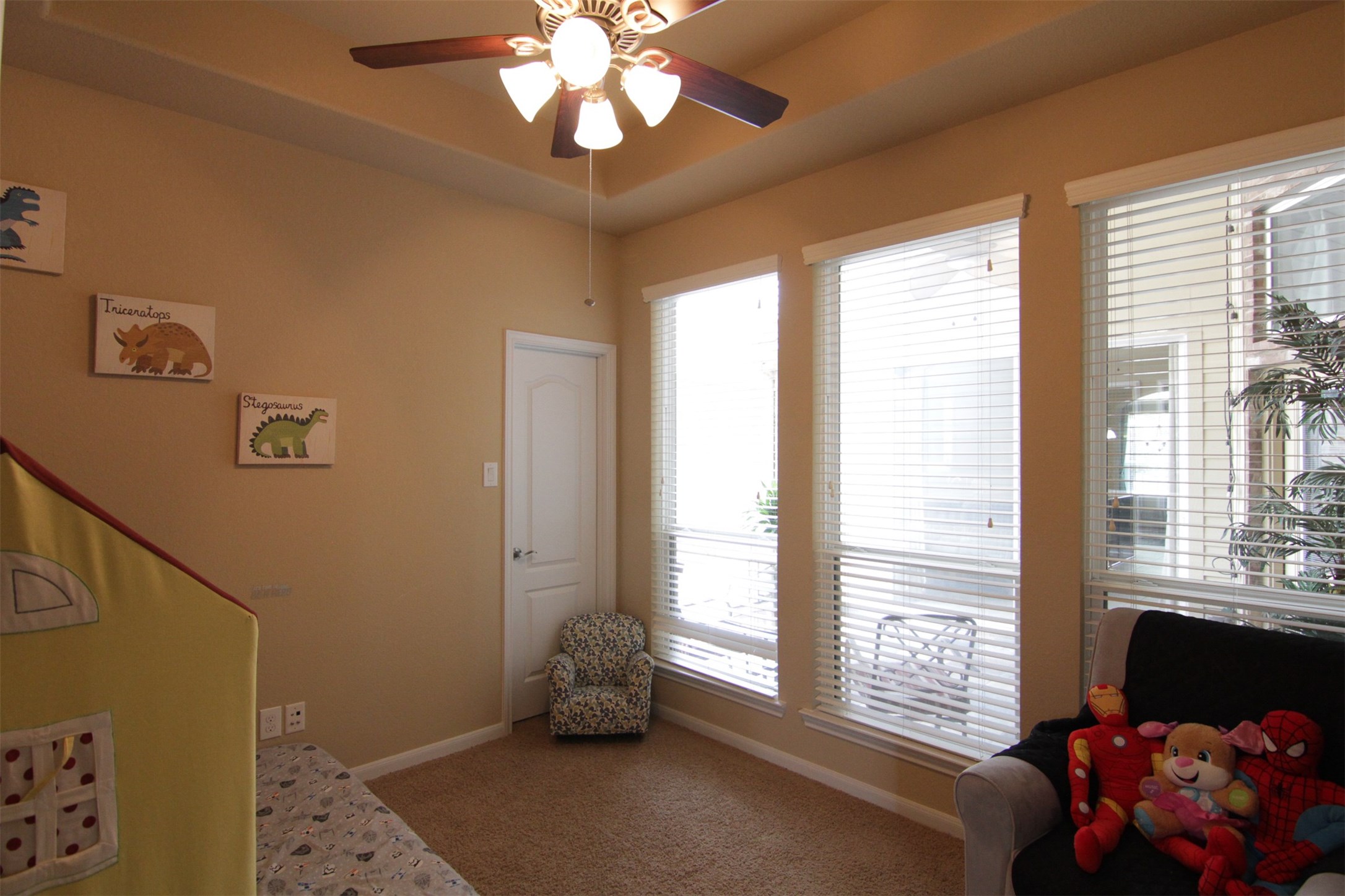 1423 Ralston Branch Way Sugar Land, TX 77479 - Photo 26 of 43 secondary bedroom with walk-in closet, ceiling fan, carpet, windows overlooking back patio oasis
