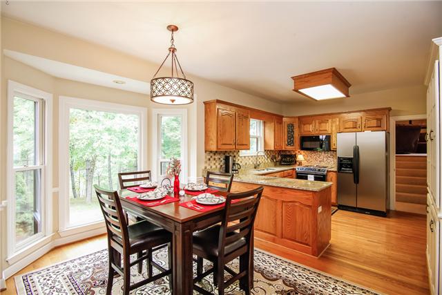 7324 Snow Mangrum Road Fairview, TN 37062 - Photo 7 of 20 Roomy breakfast area (10x12) has beautiful bay window overlooking lake and woods.