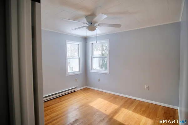 a view of an empty room with a window