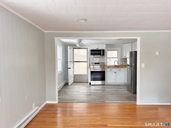 a view of kitchen with wooden floor