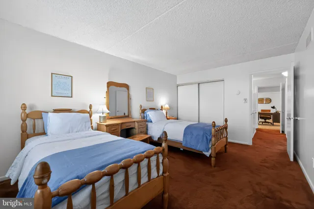 a bedroom with a bed and a couch