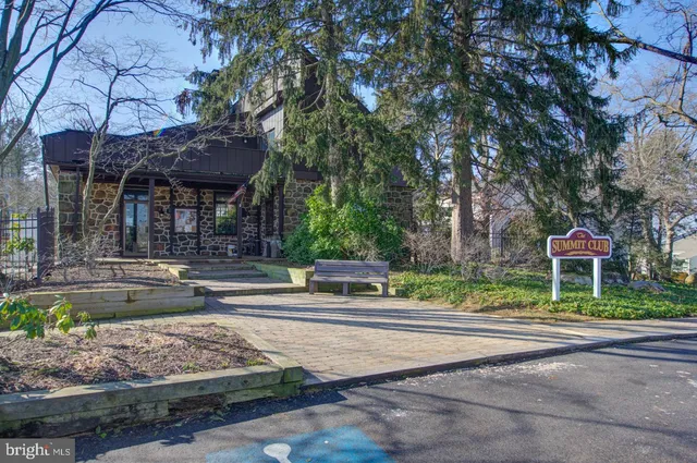 a view of a backyard with chairs