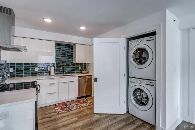 a kitchen with a stove top oven sink and cabinets