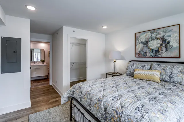 a bedroom with a bed and a view of bathroom