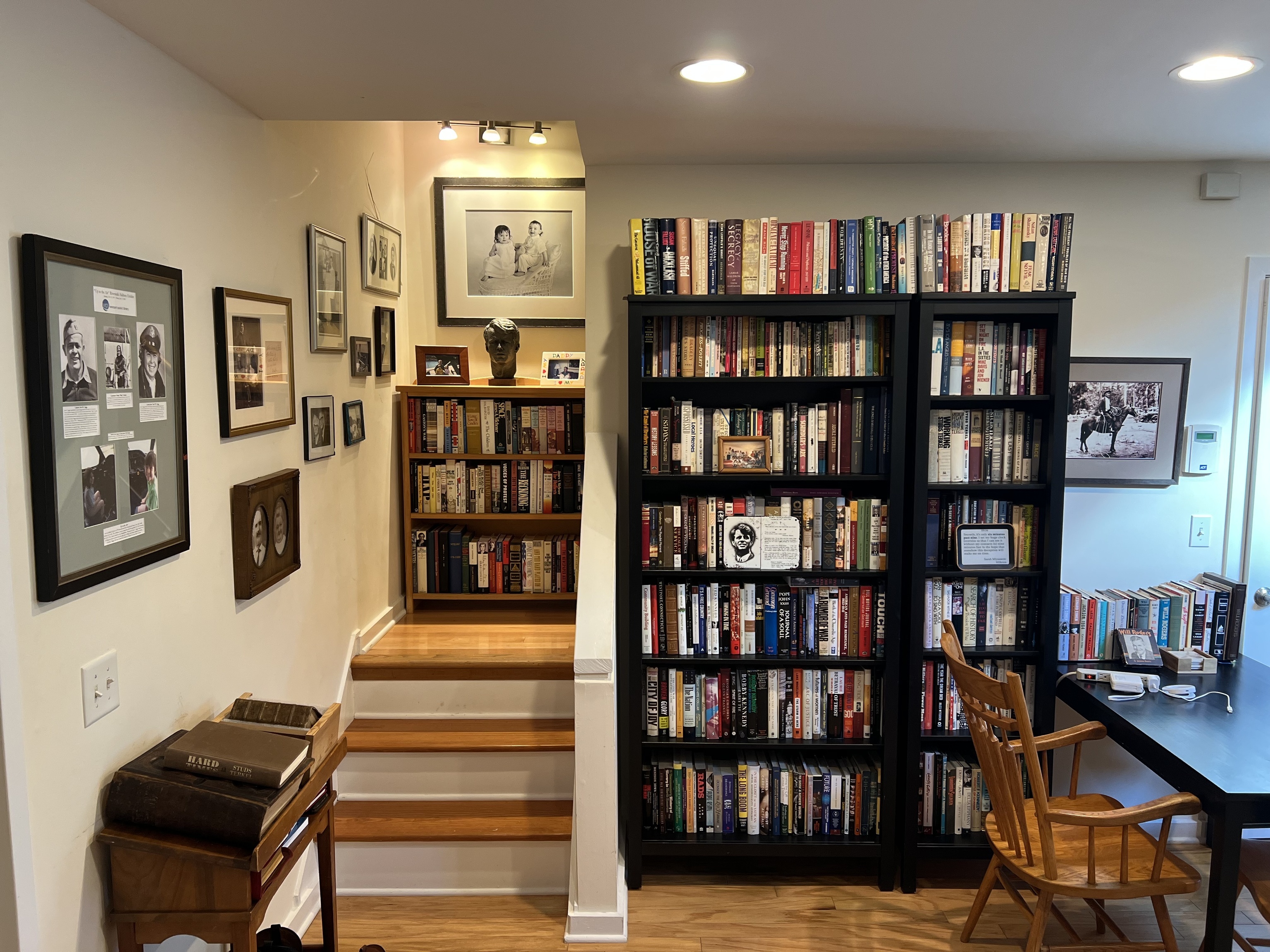301 Post Road East, Unit 8 Westport, CT 06880 - Photo 11 of 18 a living room with bookshelf and a book shelf