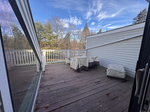 a view of two chairs in the balcony