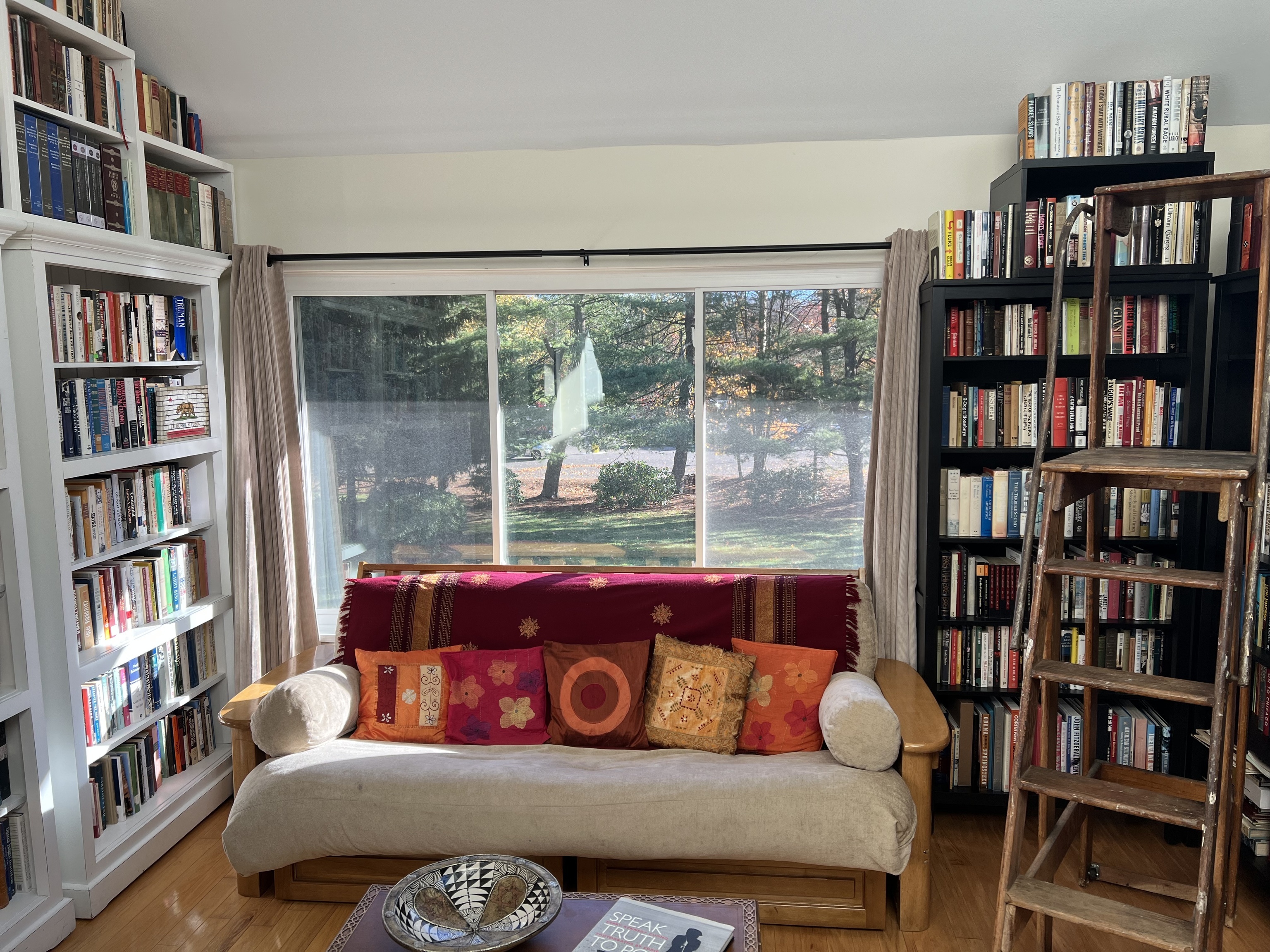 301 Post Road East, Unit 8 Westport, CT 06880 - Photo 8 of 18 a living room with furniture and a book shelf