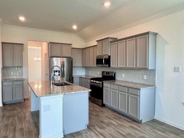 4826 Albany Ridge Lane Rosharon, TX 77583 - Photo 11 of 37 a kitchen with stainless steel appliances granite countertop a refrigerator a stove top oven a sink and dishwasher with wooden floor