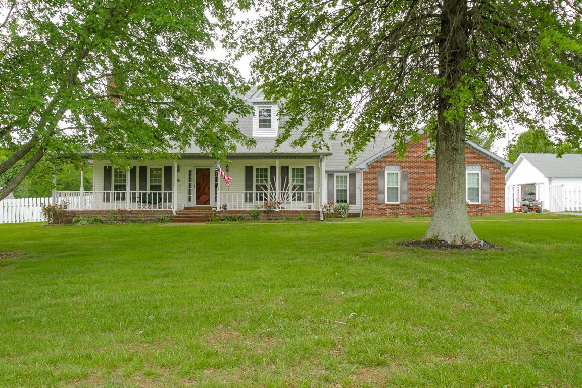 283 Lee Road Cottontown, TN 37048 - Photo 1 of 29 a front view of a house with a garden