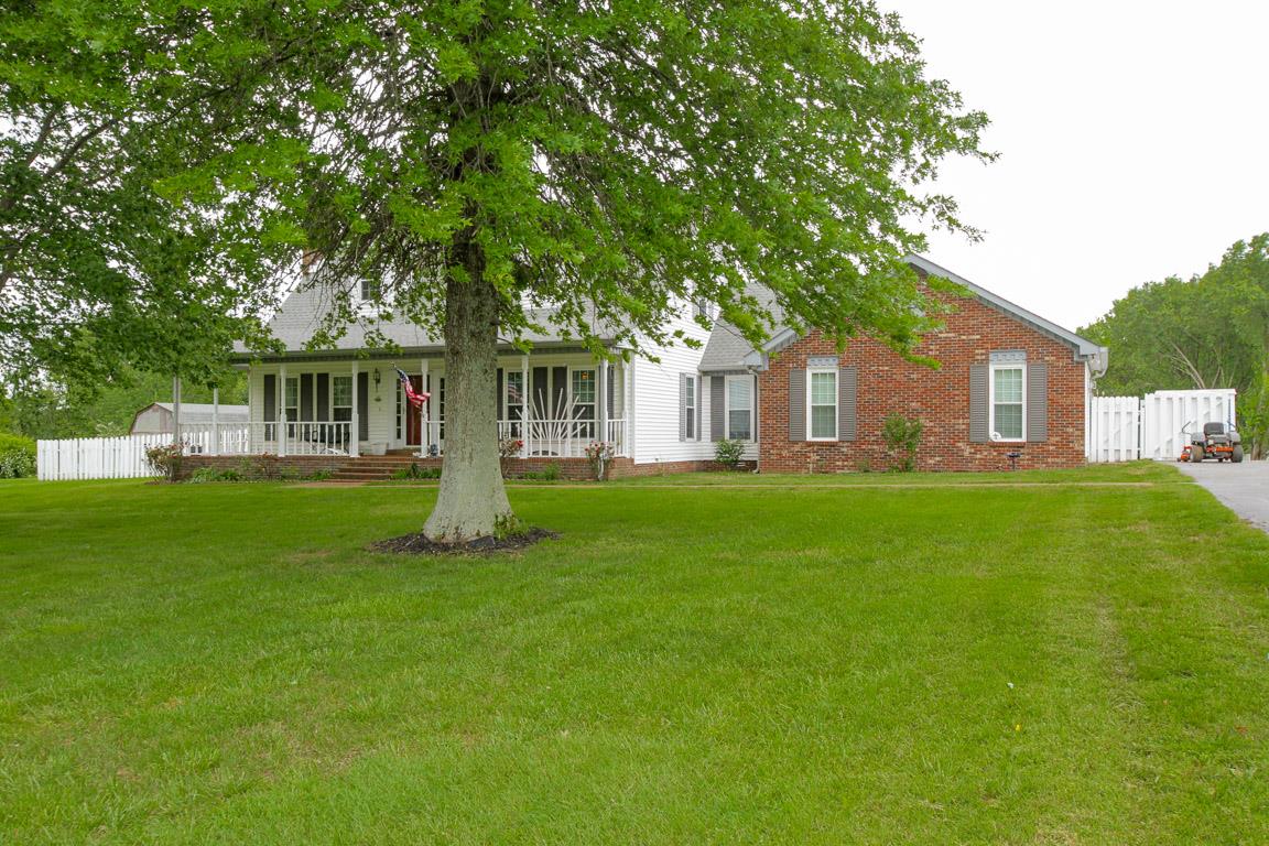 283 Lee Road Cottontown, TN 37048 - Photo 2 of 29 a front view of a house with a garden