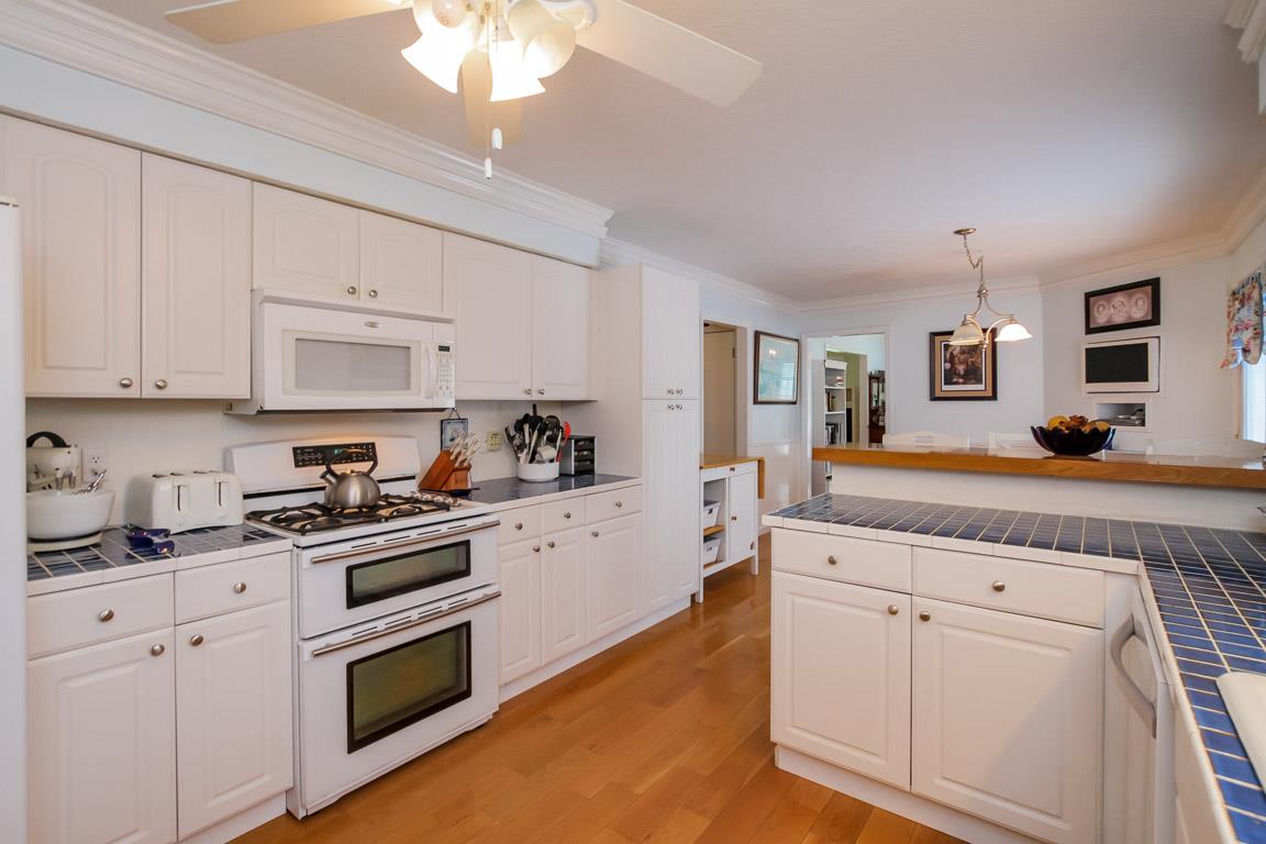 283 Lee Road Cottontown, TN 37048 - Photo 11 of 29 a kitchen with granite countertop white cabinets and white appliances