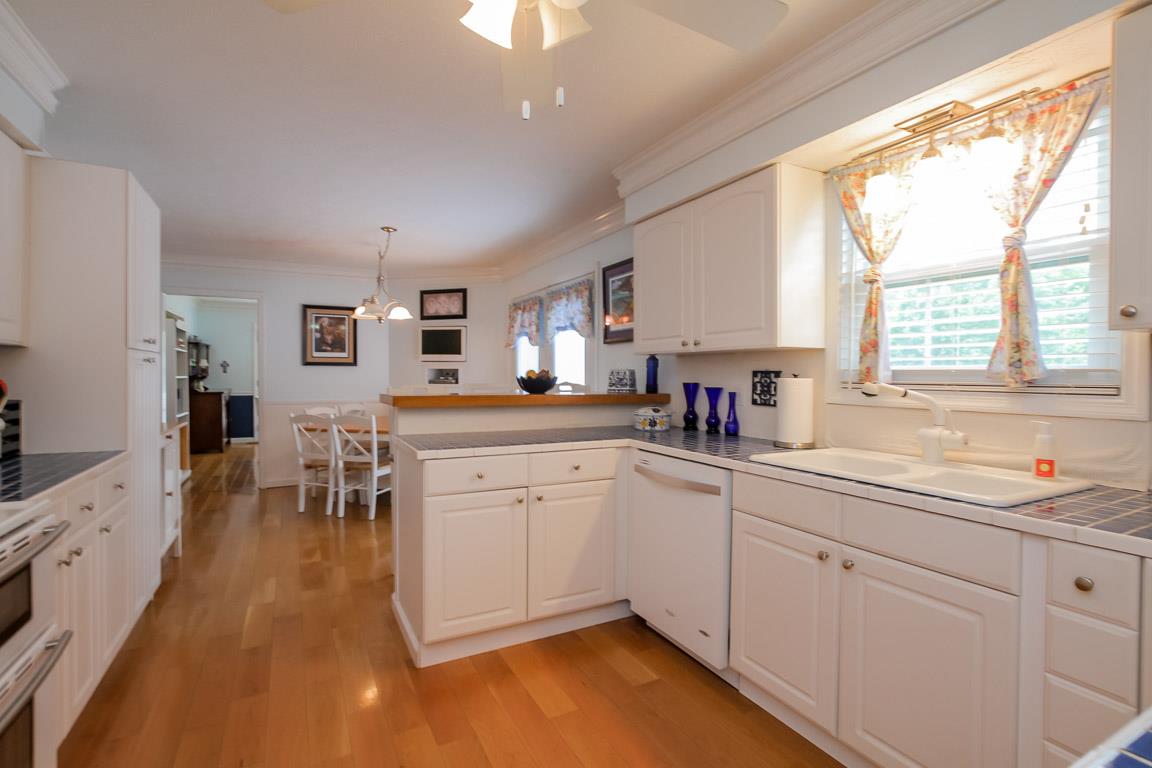 283 Lee Road Cottontown, TN 37048 - Photo 12 of 29 a kitchen with white cabinets and sink