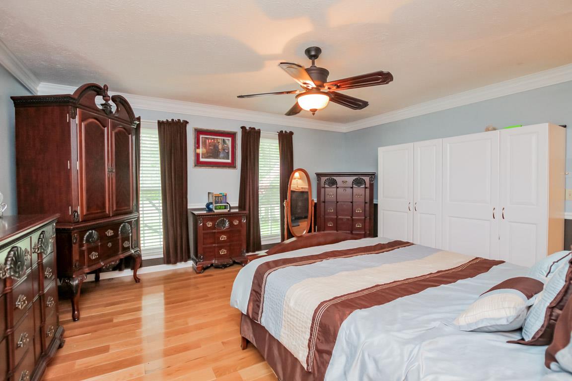 283 Lee Road Cottontown, TN 37048 - Photo 13 of 29 a bedroom with a bed dresser and a window