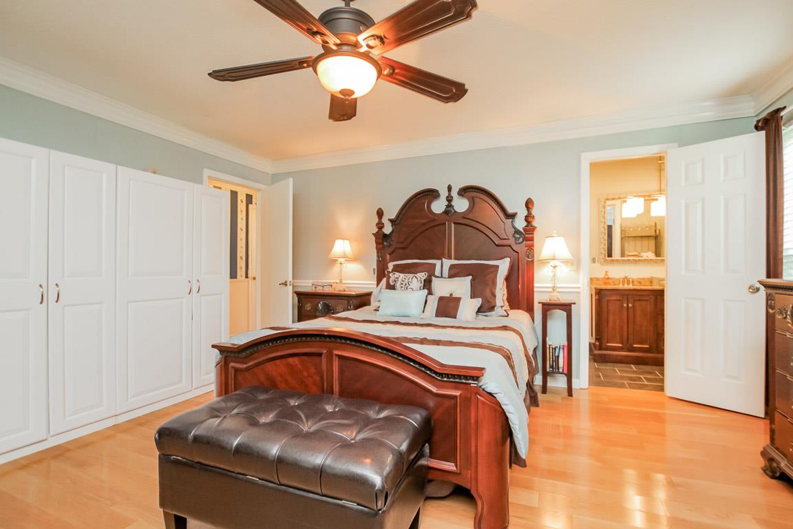 283 Lee Road Cottontown, TN 37048 - Photo 14 of 29 a bedroom with a bed and a chandelier