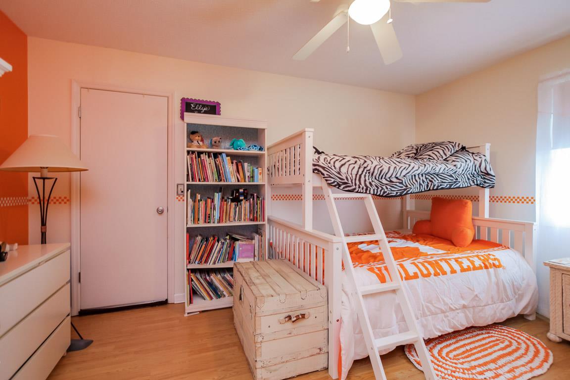 283 Lee Road Cottontown, TN 37048 - Photo 19 of 29 a bedroom with a bed and a book shelf