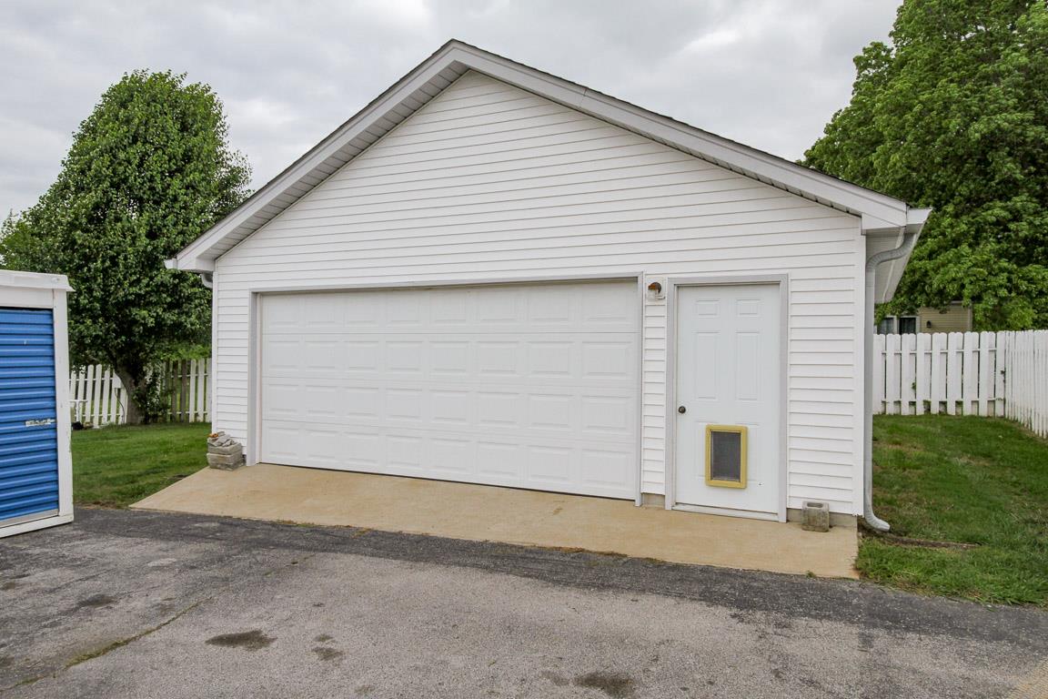 283 Lee Road Cottontown, TN 37048 - Photo 21 of 29 a view of a house with a yard and garage