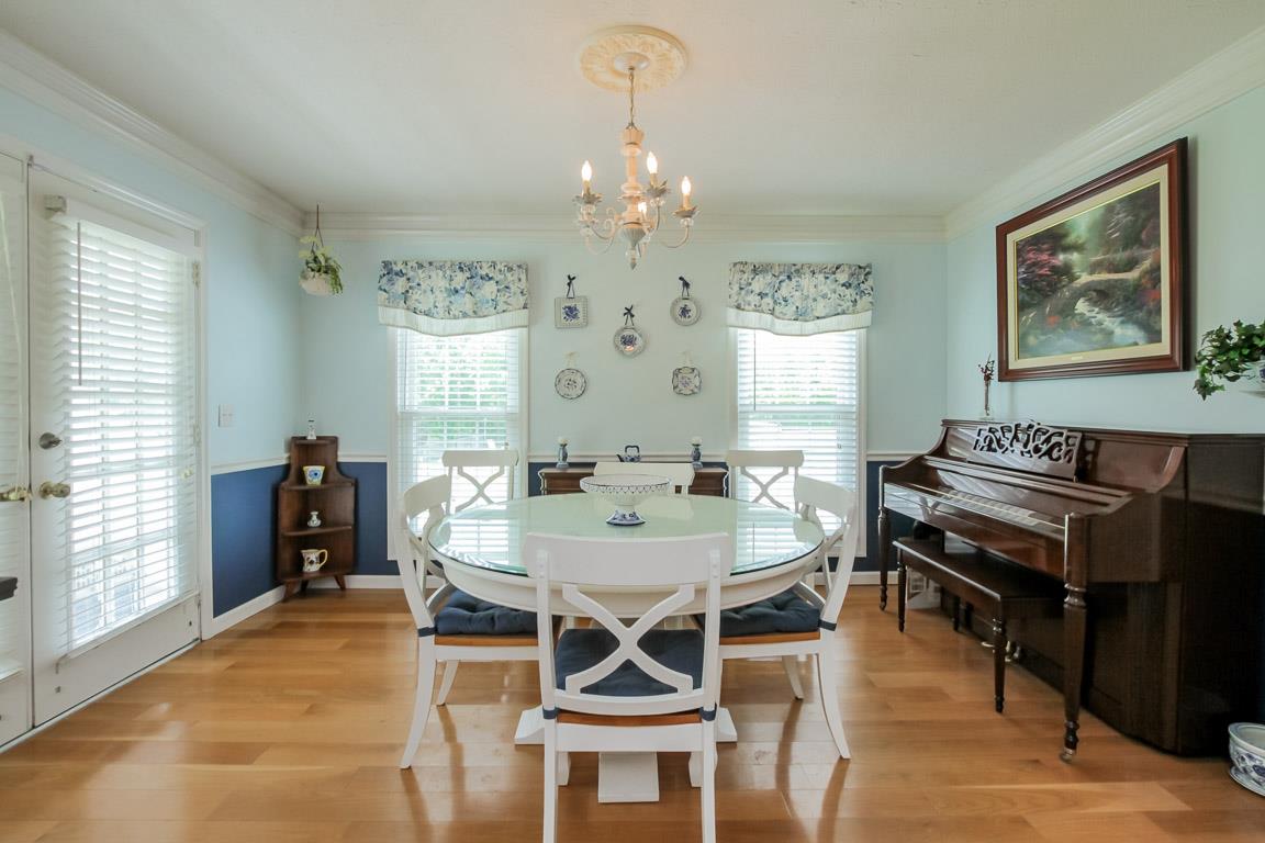 283 Lee Road Cottontown, TN 37048 - Photo 6 of 29 a view of a dining room with furniture window and wooden floor