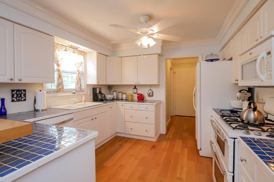 283 Lee Road Cottontown, TN 37048 - Photo 10 of 29 a kitchen with white cabinets and appliances