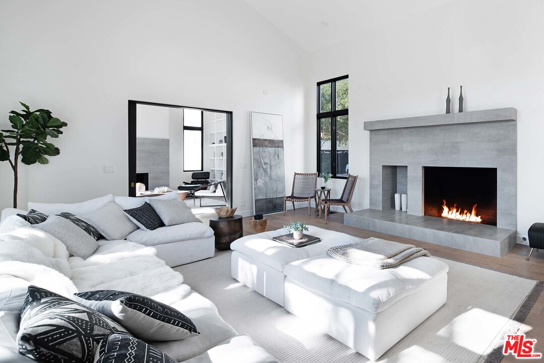 3170 Santa Maria Road Topanga, CA 90290 - Photo 11 of 60 a living room with furniture and a fireplace