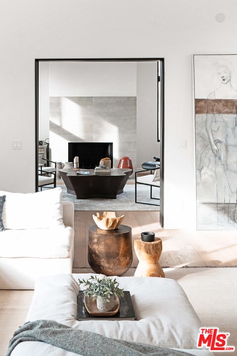 3170 Santa Maria Road Topanga, CA 90290 - Photo 12 of 60 a living room with furniture and a fireplace