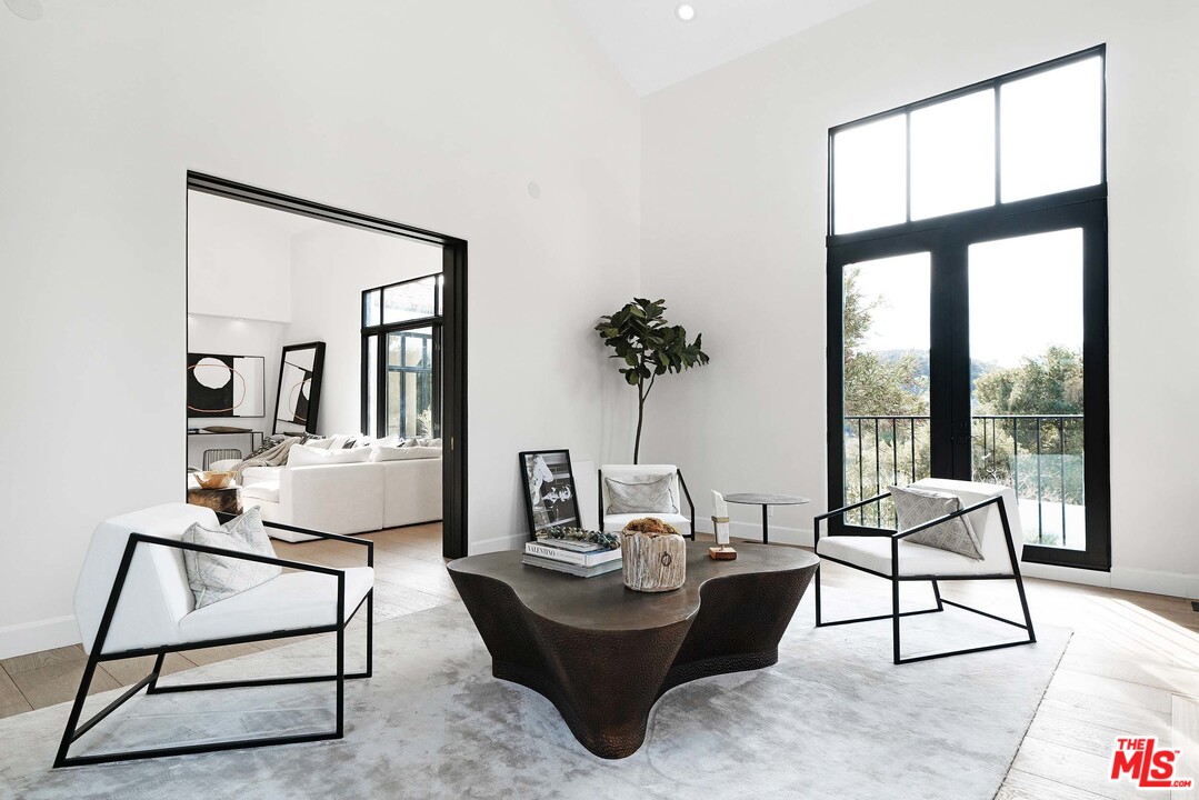 3170 Santa Maria Road Topanga, CA 90290 - Photo 14 of 60 a living room with furniture and a potted plant
