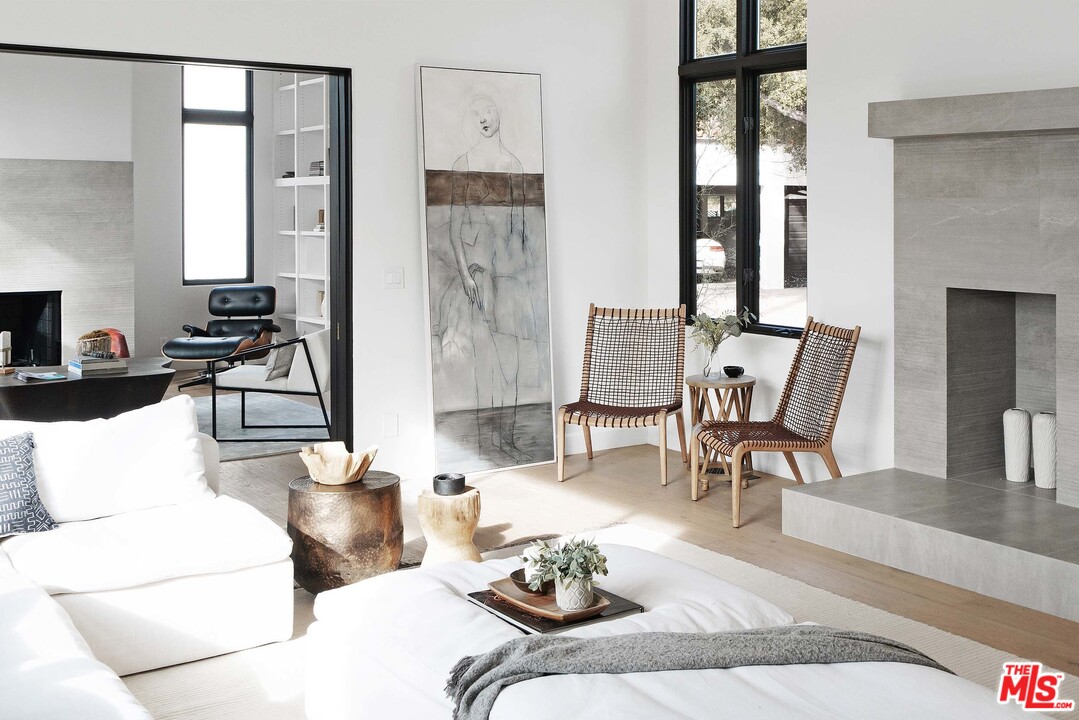3170 Santa Maria Road Topanga, CA 90290 - Photo 15 of 60 a living room with furniture and a fireplace