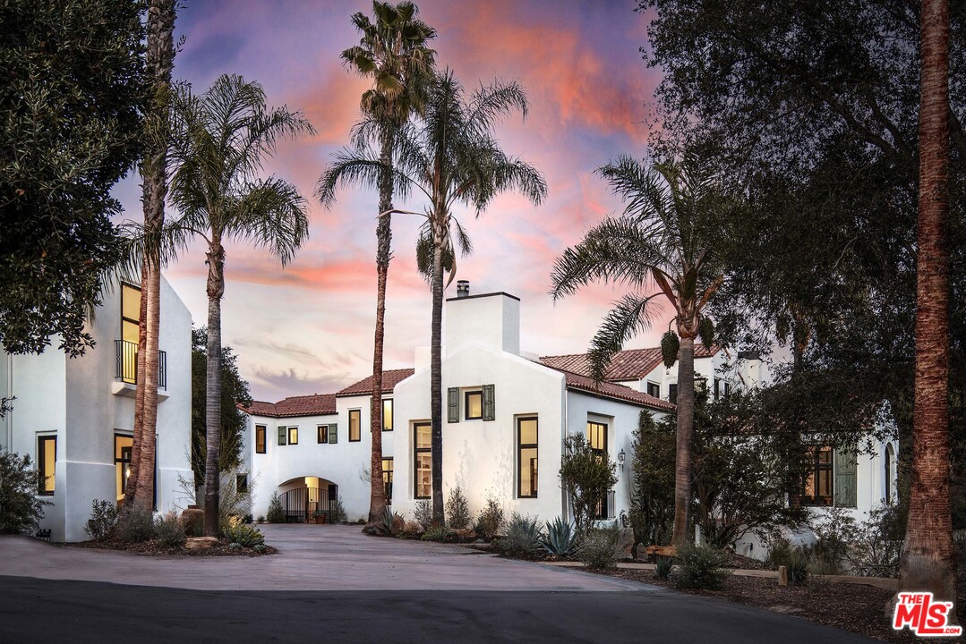 3170 Santa Maria Road Topanga, CA 90290 - Photo 2 of 60 a view of a white house with a tree and plants