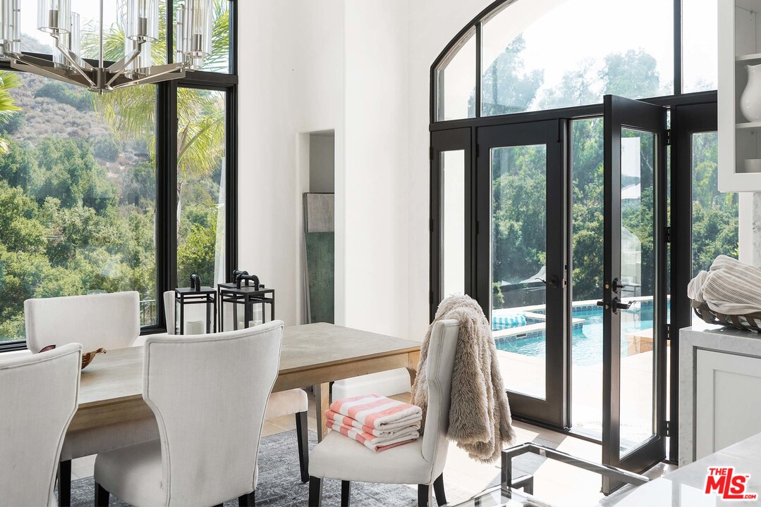 3170 Santa Maria Road Topanga, CA 90290 - Photo 24 of 60 a view of a dining room with furniture window and outside view