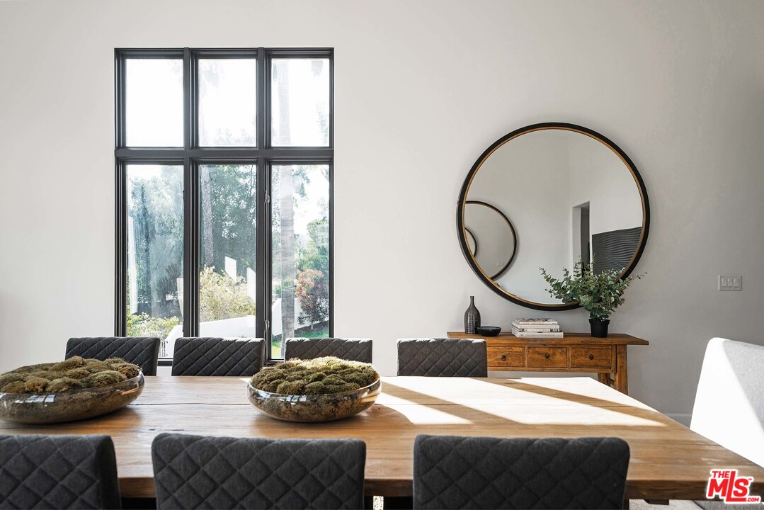 3170 Santa Maria Road Topanga, CA 90290 - Photo 27 of 60 a living room with furniture and a large window