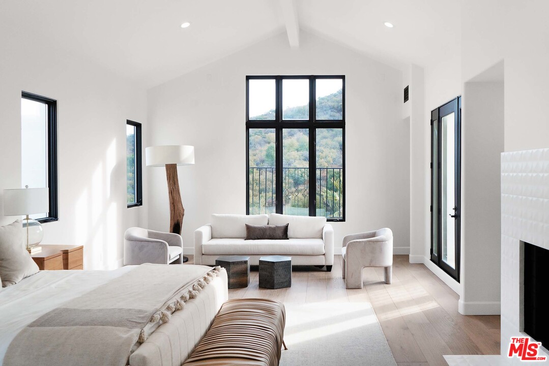 3170 Santa Maria Road Topanga, CA 90290 - Photo 33 of 60 a bedroom with furniture and a large window