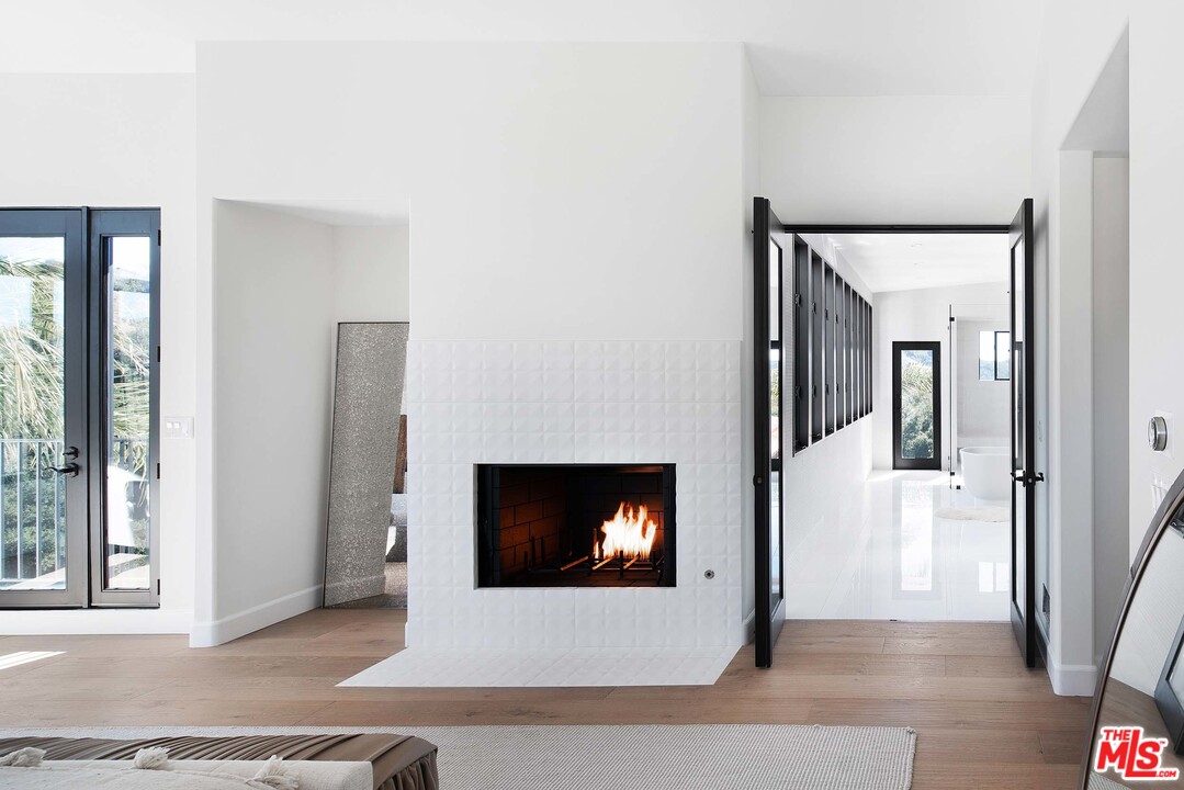 3170 Santa Maria Road Topanga, CA 90290 - Photo 34 of 60 a living room with a fireplace and a fireplace