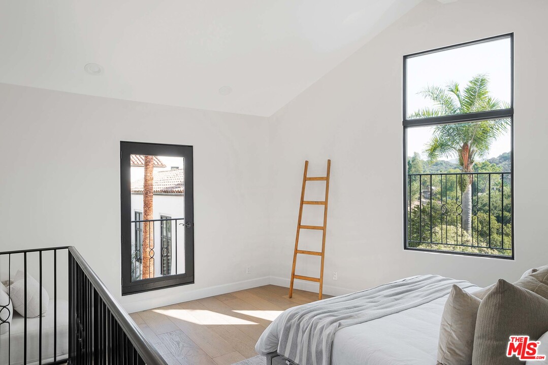 3170 Santa Maria Road Topanga, CA 90290 - Photo 44 of 60 a bedroom with a bed and a window