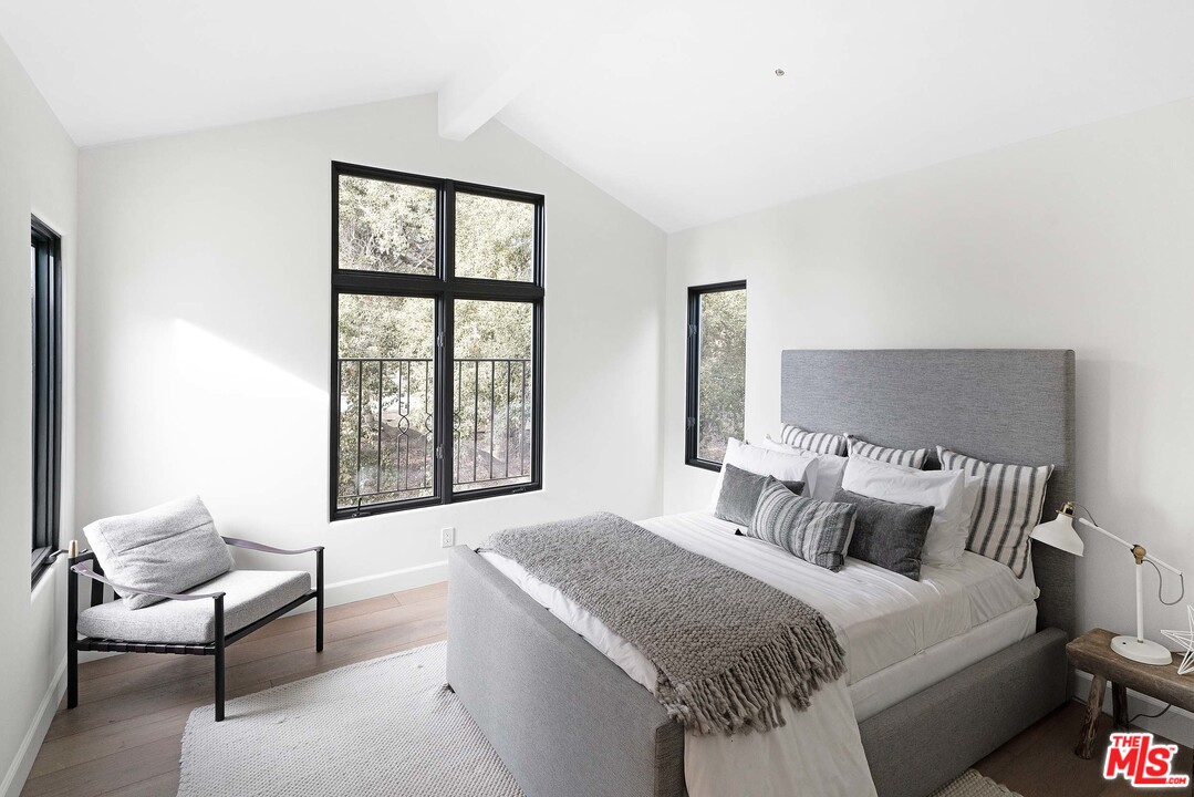 3170 Santa Maria Road Topanga, CA 90290 - Photo 45 of 60 a bedroom with a bed and a window