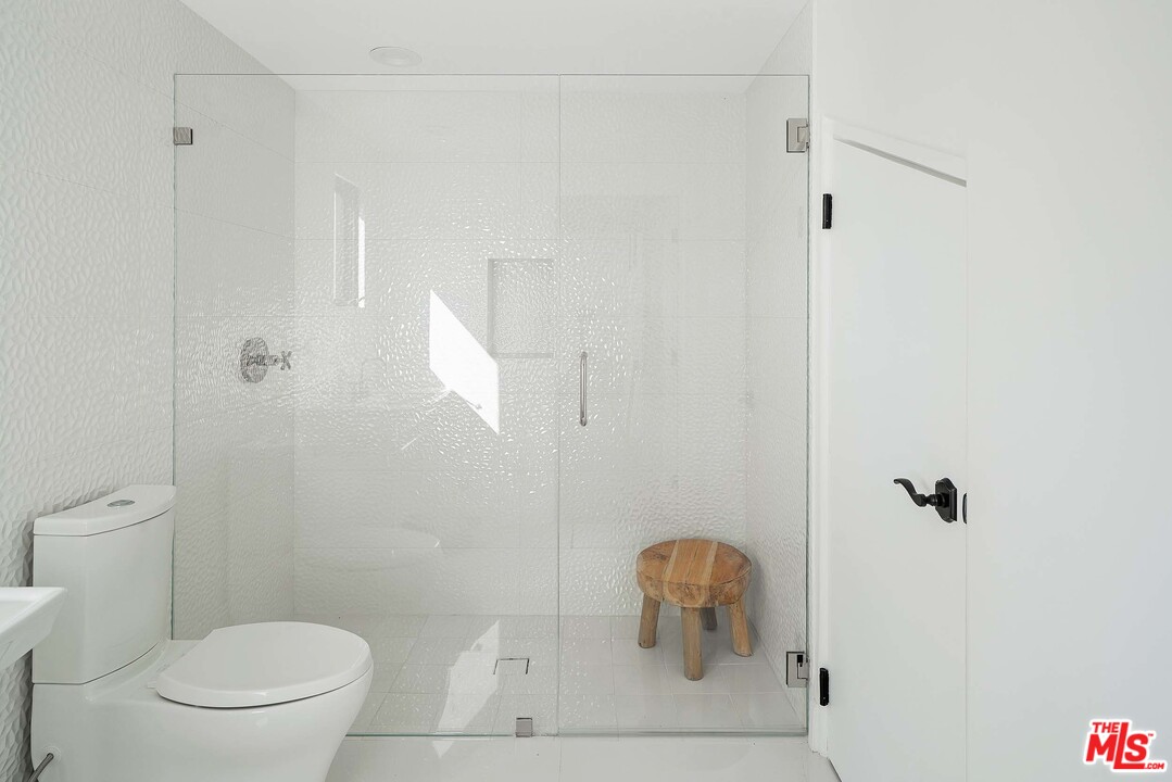 3170 Santa Maria Road Topanga, CA 90290 - Photo 47 of 60 a bathroom with a toilet and a shower