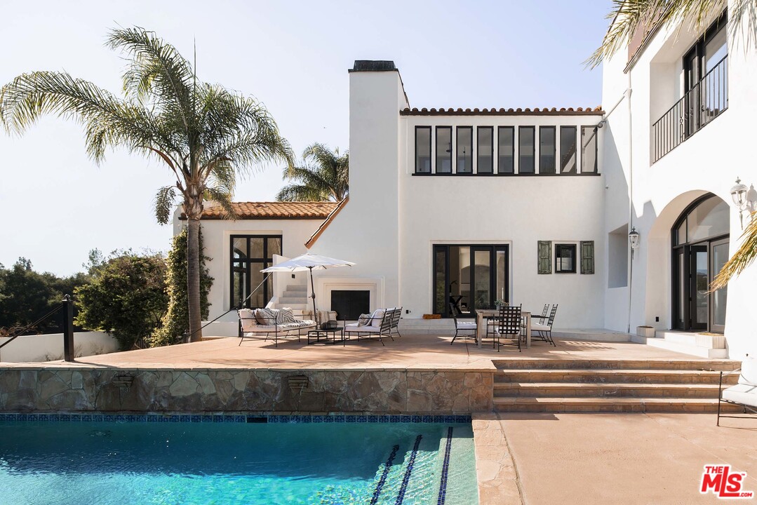 3170 Santa Maria Road Topanga, CA 90290 - Photo 49 of 60 a view of building with outdoor space and swimming pool