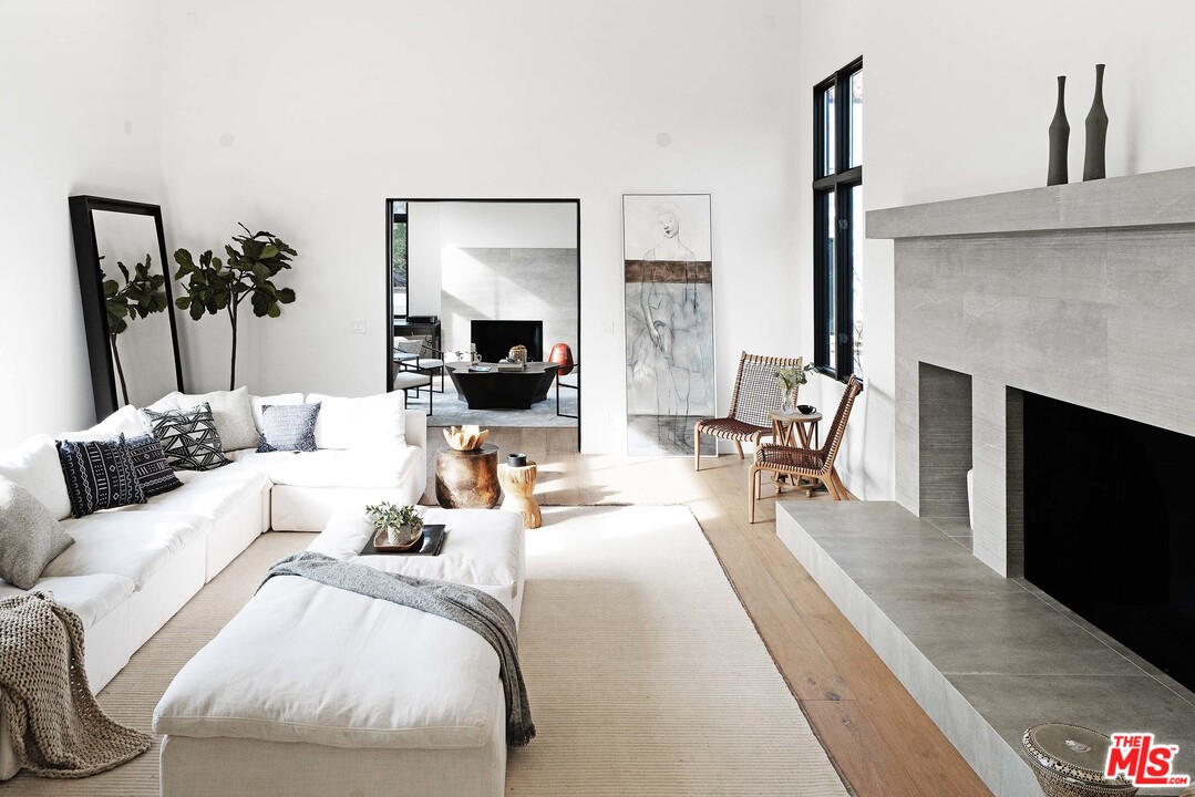 3170 Santa Maria Road Topanga, CA 90290 - Photo 8 of 60 a living room with furniture and a fireplace