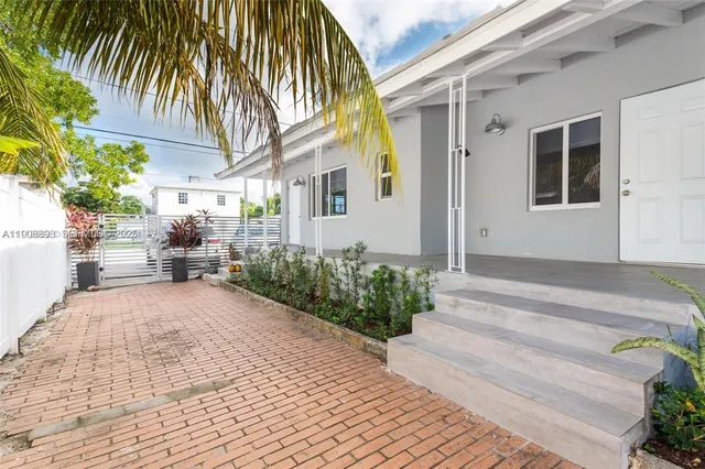 a backyard of a house with seating space