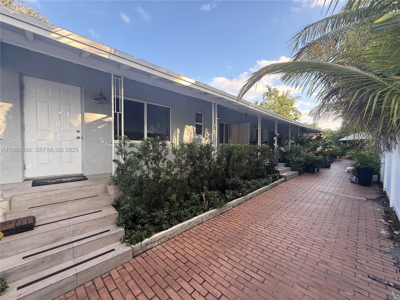 540 Northeast 67th Street, Unit 540 Miami, FL 33138 - Photo 15 of 16 a view of a house with a yard