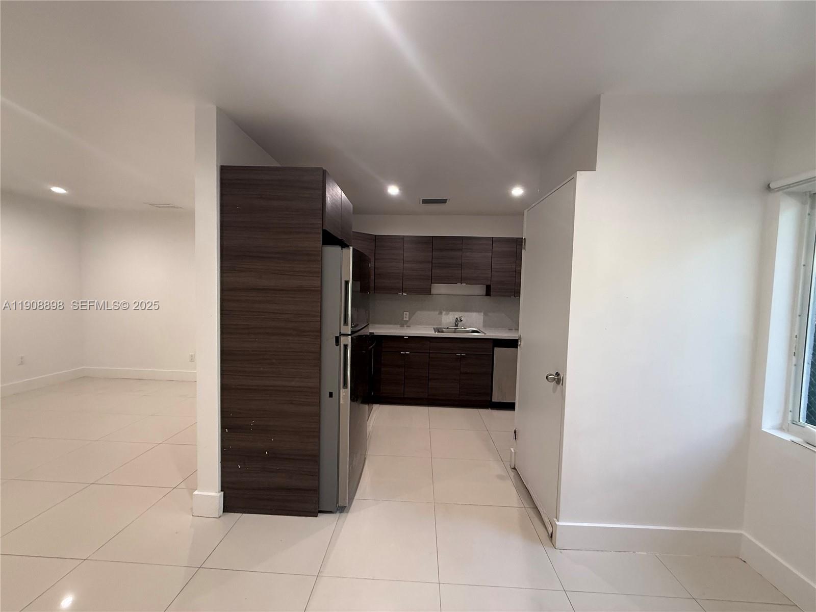 540 Northeast 67th Street, Unit 540 Miami, FL 33138 - Photo 4 of 16 a view of kitchen with a sink