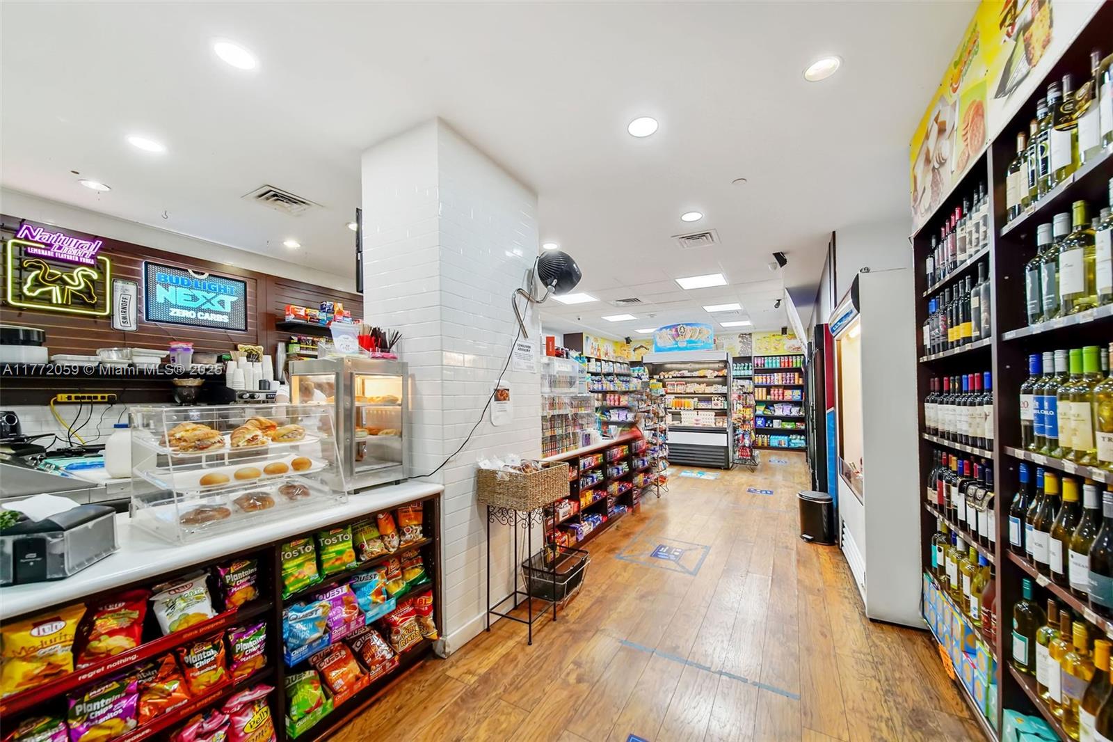 1035 West Avenue, Unit 507 Miami Beach, FL 33139 - Photo 15 of 22 a hallway with a book shelf and a book shelf